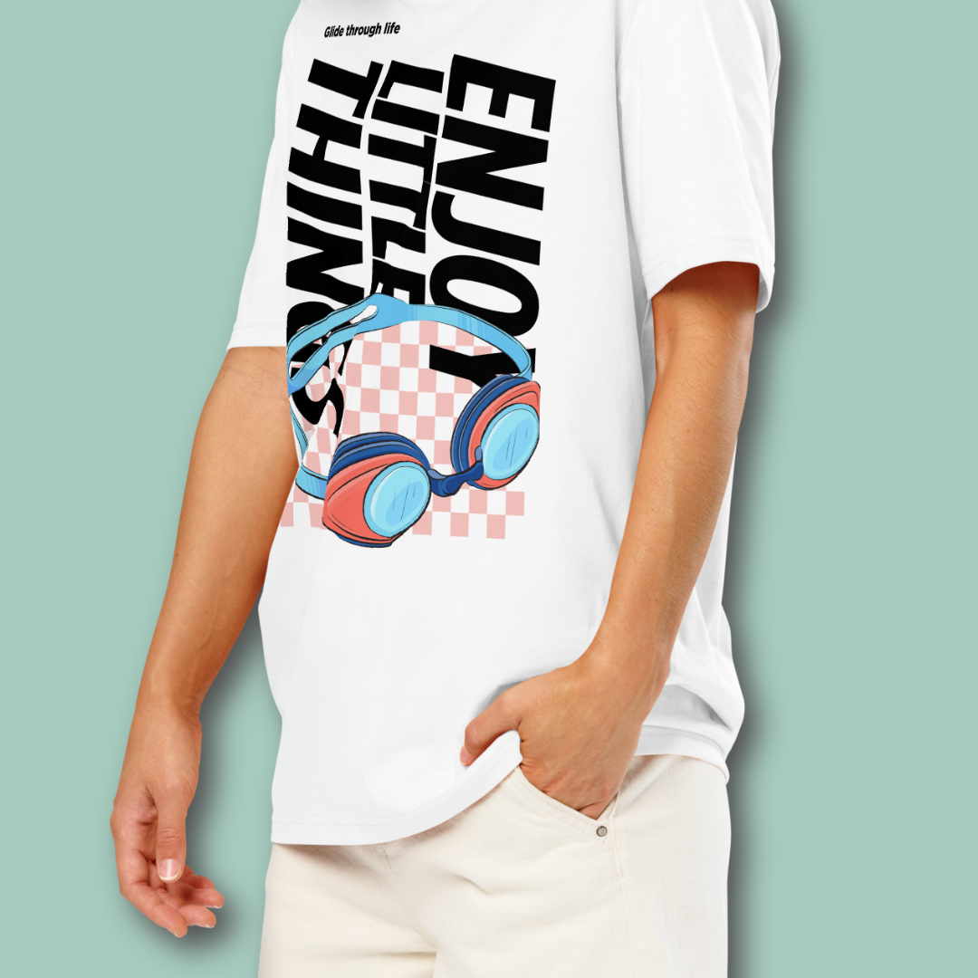 Person wearing a white organic post swim shirt with a swim-themed graphic design and text on a light green background