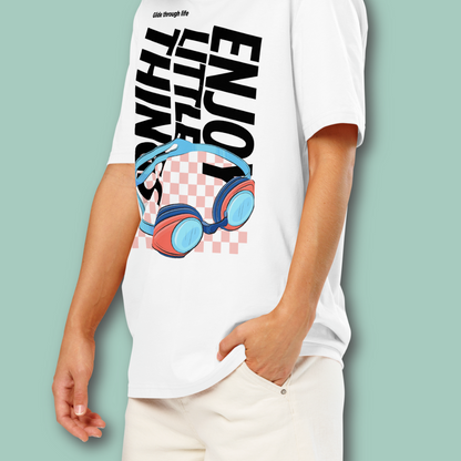 Person wearing a white organic post swim shirt with a swim-themed graphic design and text on a light green background