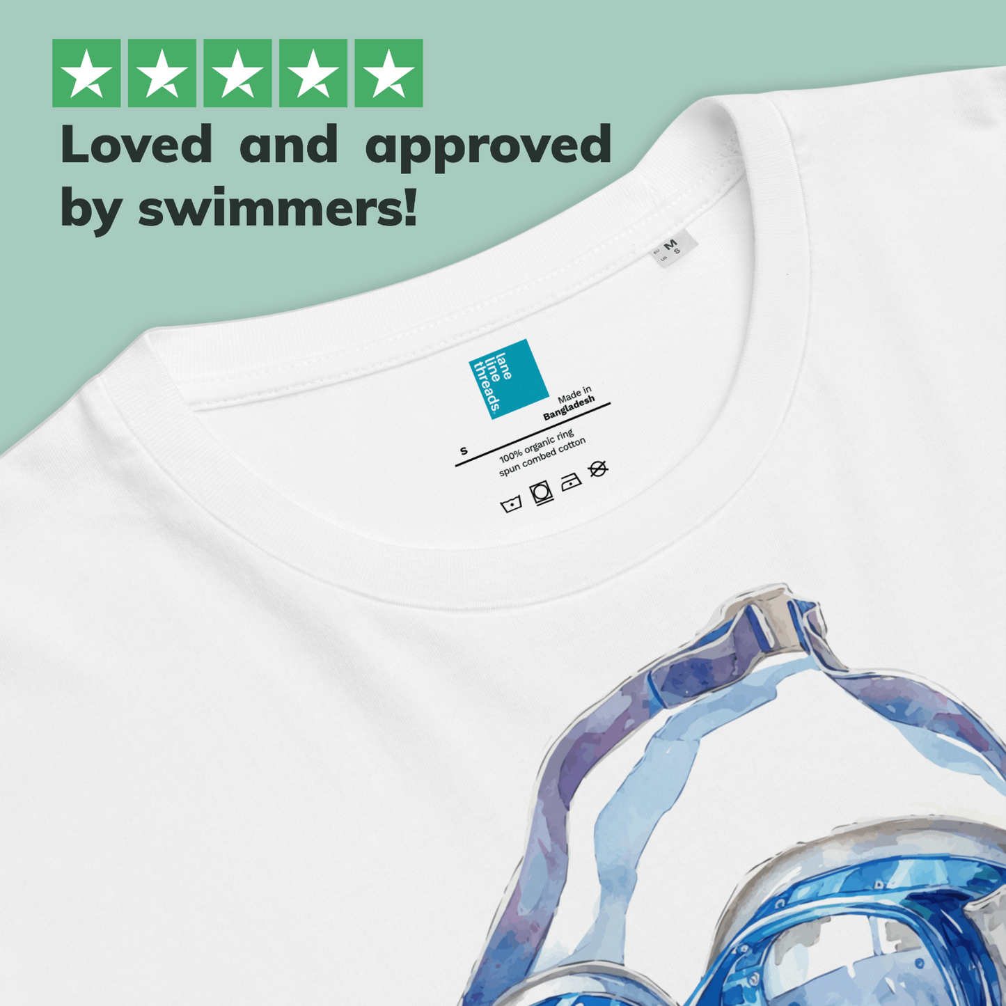 White post swim organic shirt with swim goggles on a light green background, featuring text 'Loved and approved by swimmers!'.