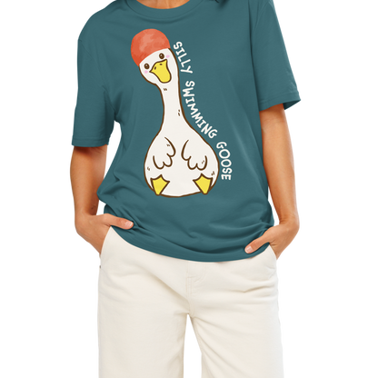 Woman wearing a teal post swim organic cotton t-shirt with a swim-themed graphic design on a white background