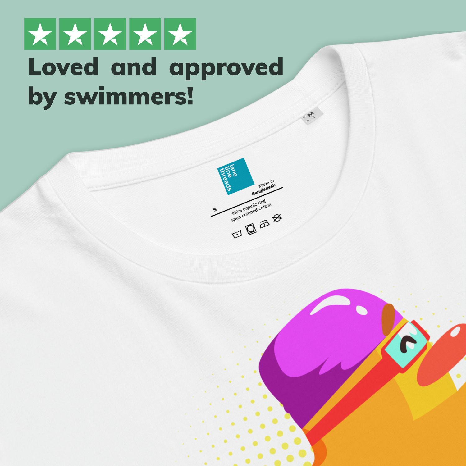 White post swim organic shirt with colorful swim-themed graphic design on a light green background, featuring text 'Loved and approved by swimmers!'.