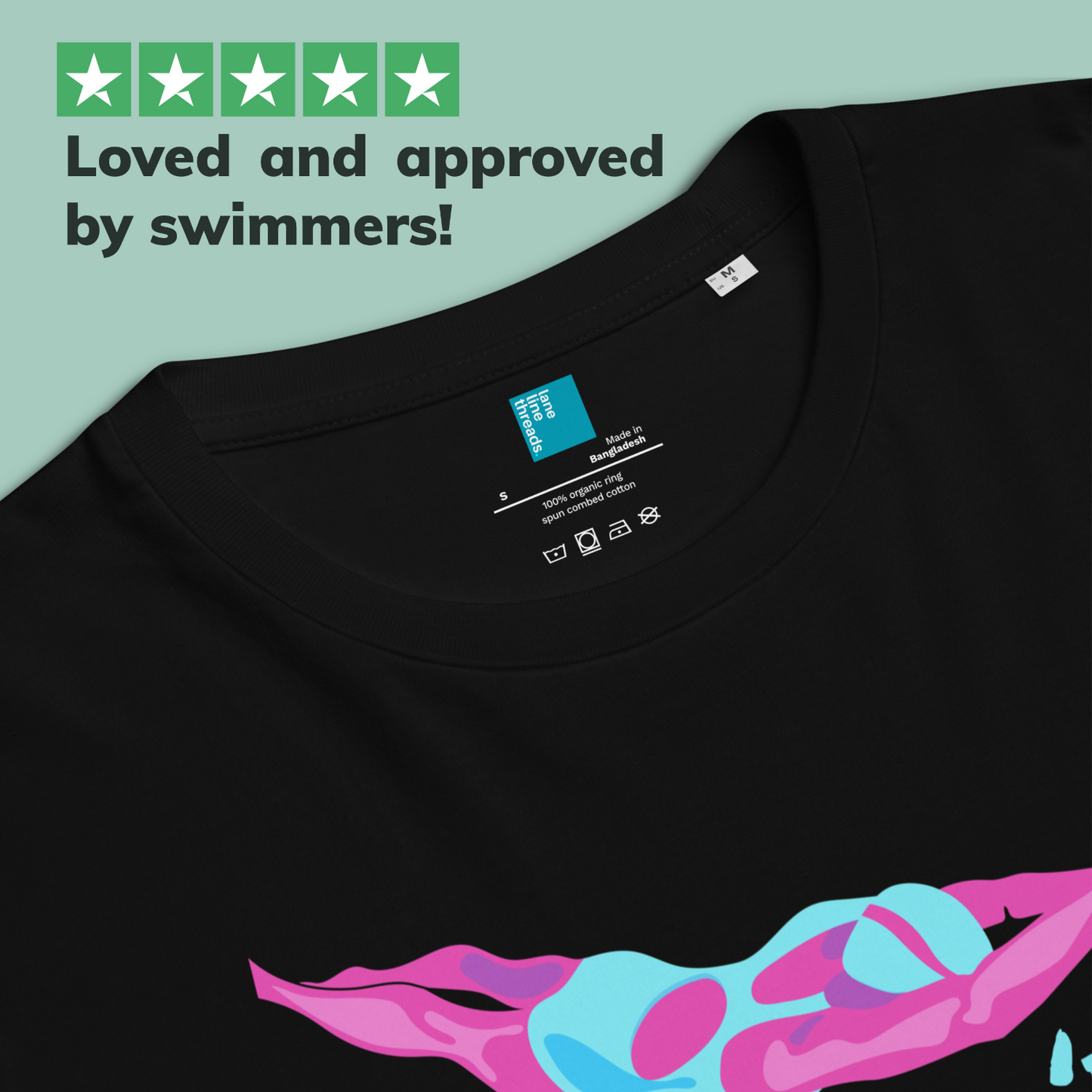 Black organic cotton tee for swimmers with sensitive skin with colorful swim-themed graphic design on a light blue background, featuring text 'Loved and approved by swimmers!'.