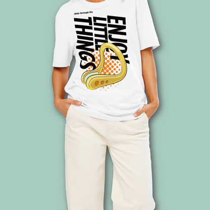 Person wearing a white post swim organic shirt with a swim-themed graphic design and text on a light green background