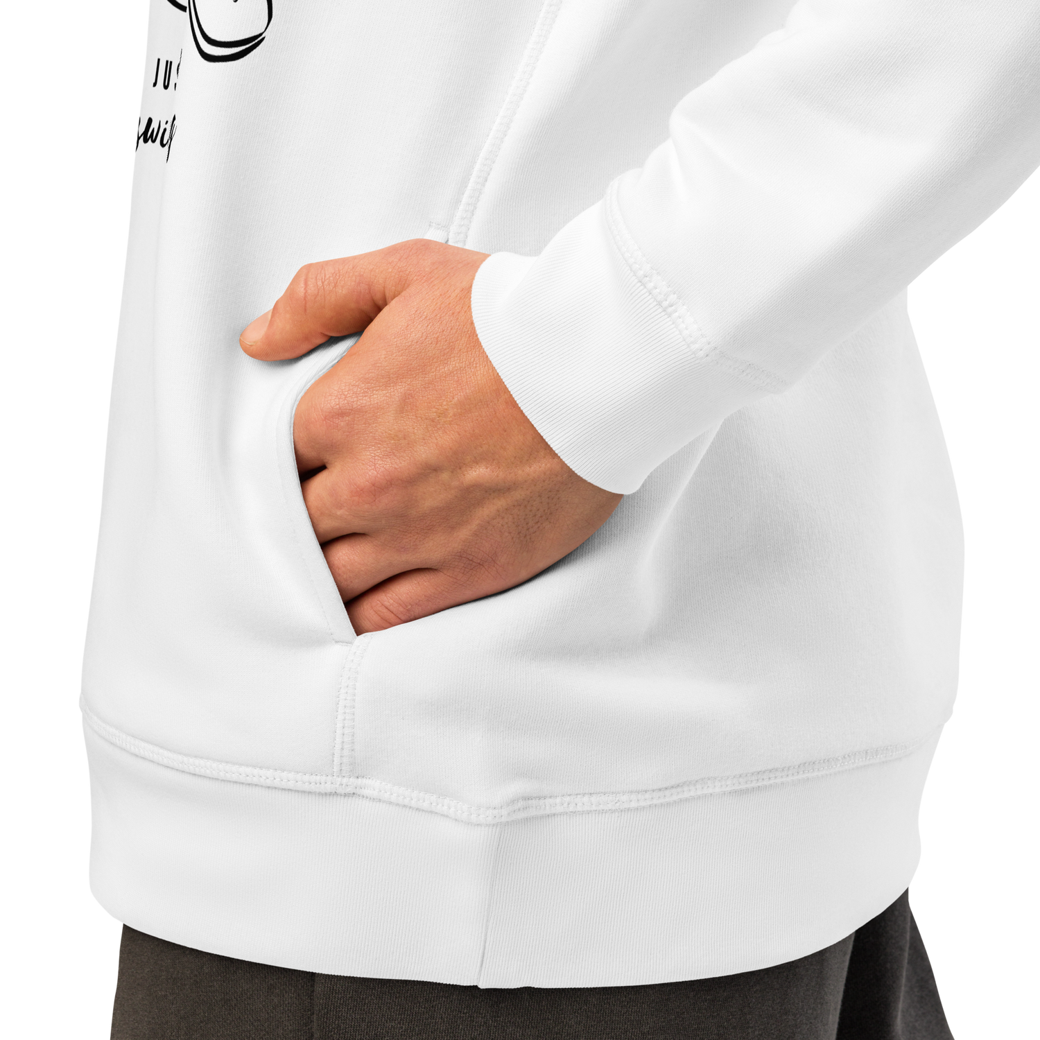 Person wearing a white organic swim hoodie with a hand in the pocket on a plain background