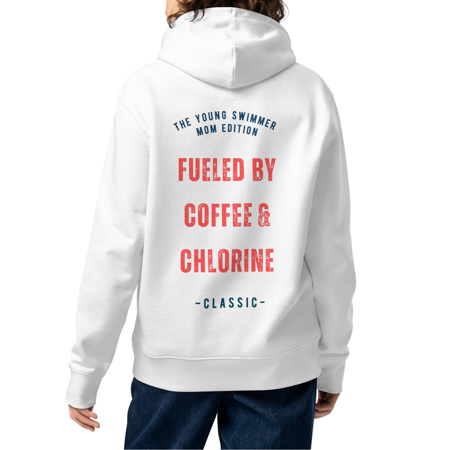 Person wearing a white organic hoodie with red distressed varsity-style graphic on the back reading "Fueled by Coffee & Chlorine — The Young Swimmer Mom Edition Classic" — swim mom sweatshirt by Lane Line Threads.