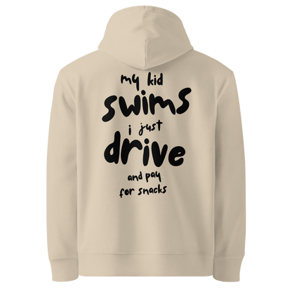 Beige swim mom organic hoodie with bold black hand-lettered graphic on the back reading "my kid swims i just drive and pay for snacks" — funny swim mom sweatshirt by Lane Line Threads.