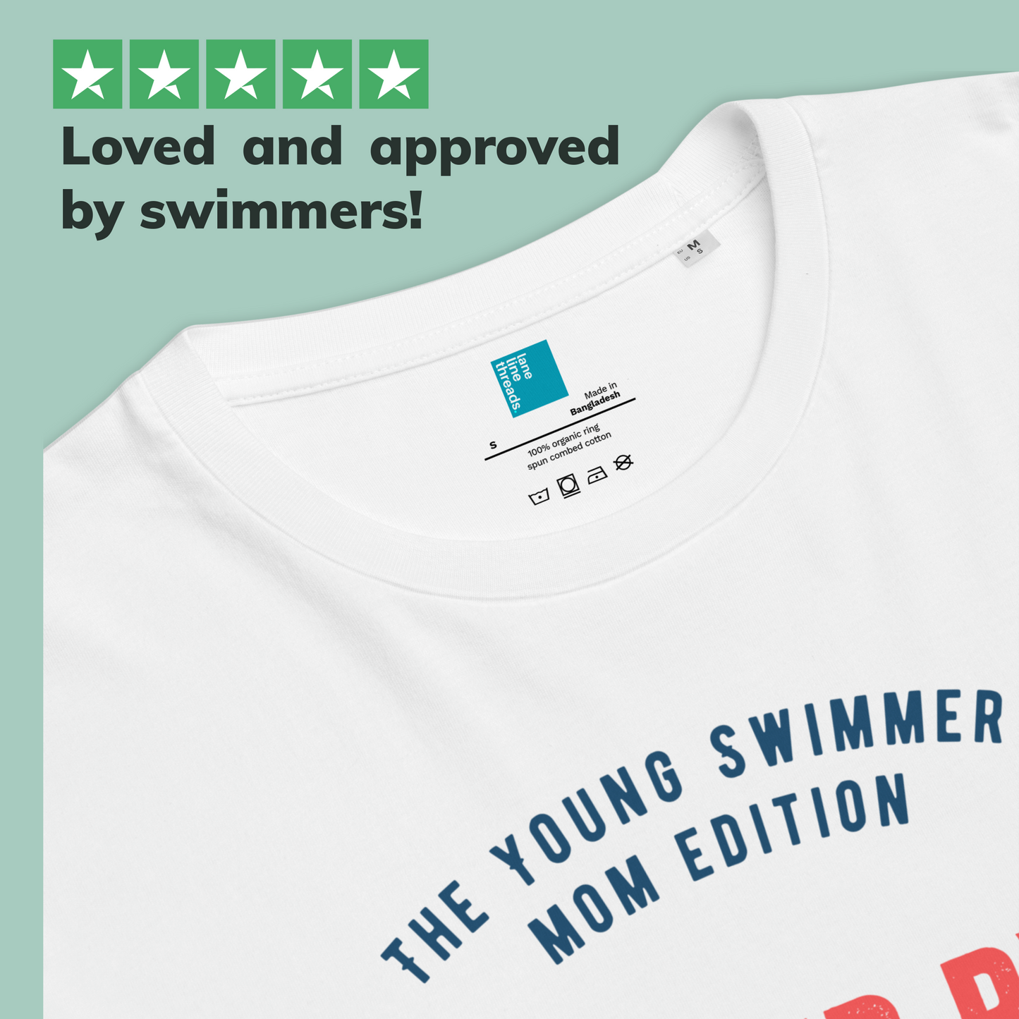 White organic swim mom shirt with text 'The Young Swimmer Mom Edition' and a Lane Line Threads brand label on a light green background.