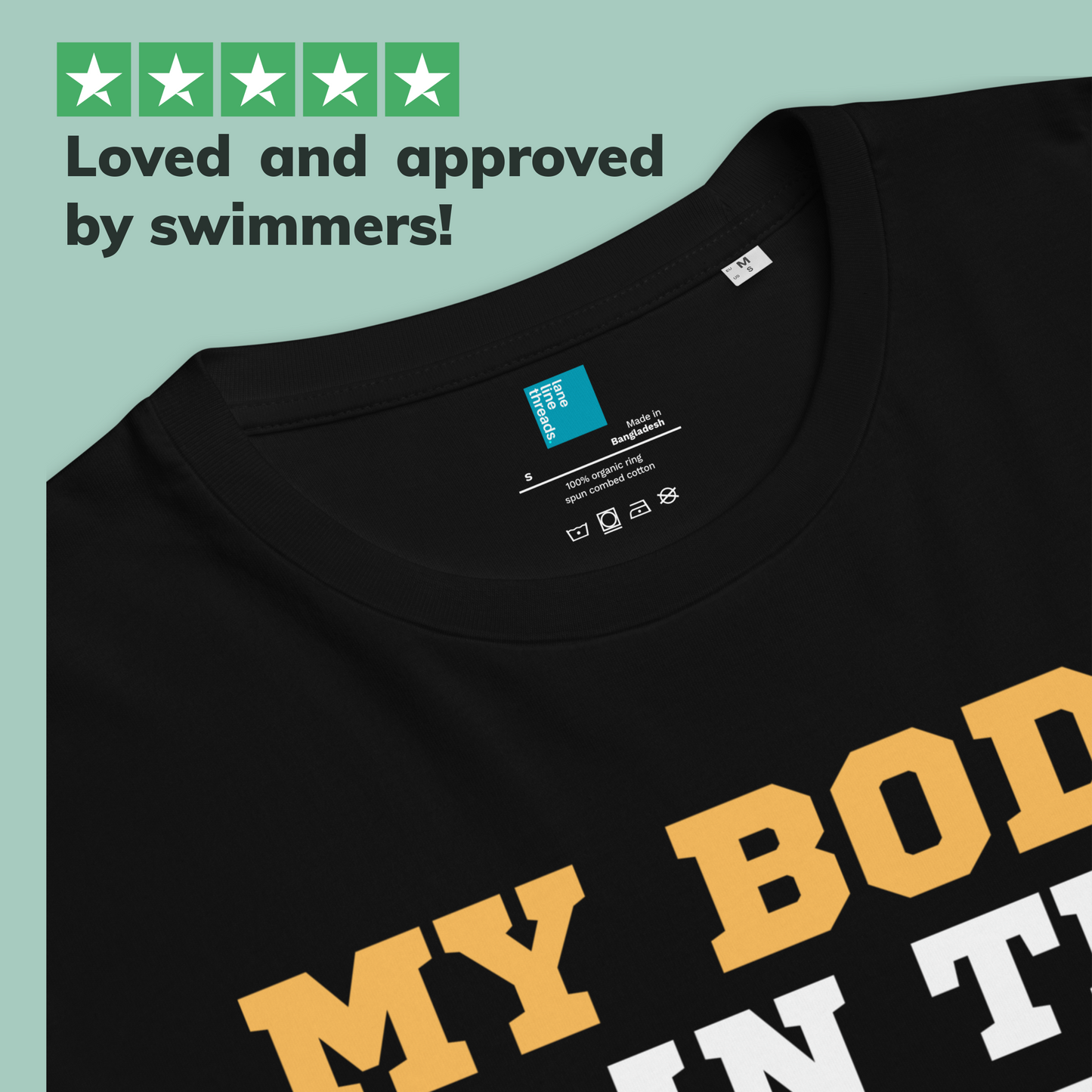 Black organic swim mom shirt with yellow and white text on a light blue background, featuring a Lane Line Threads brand label.