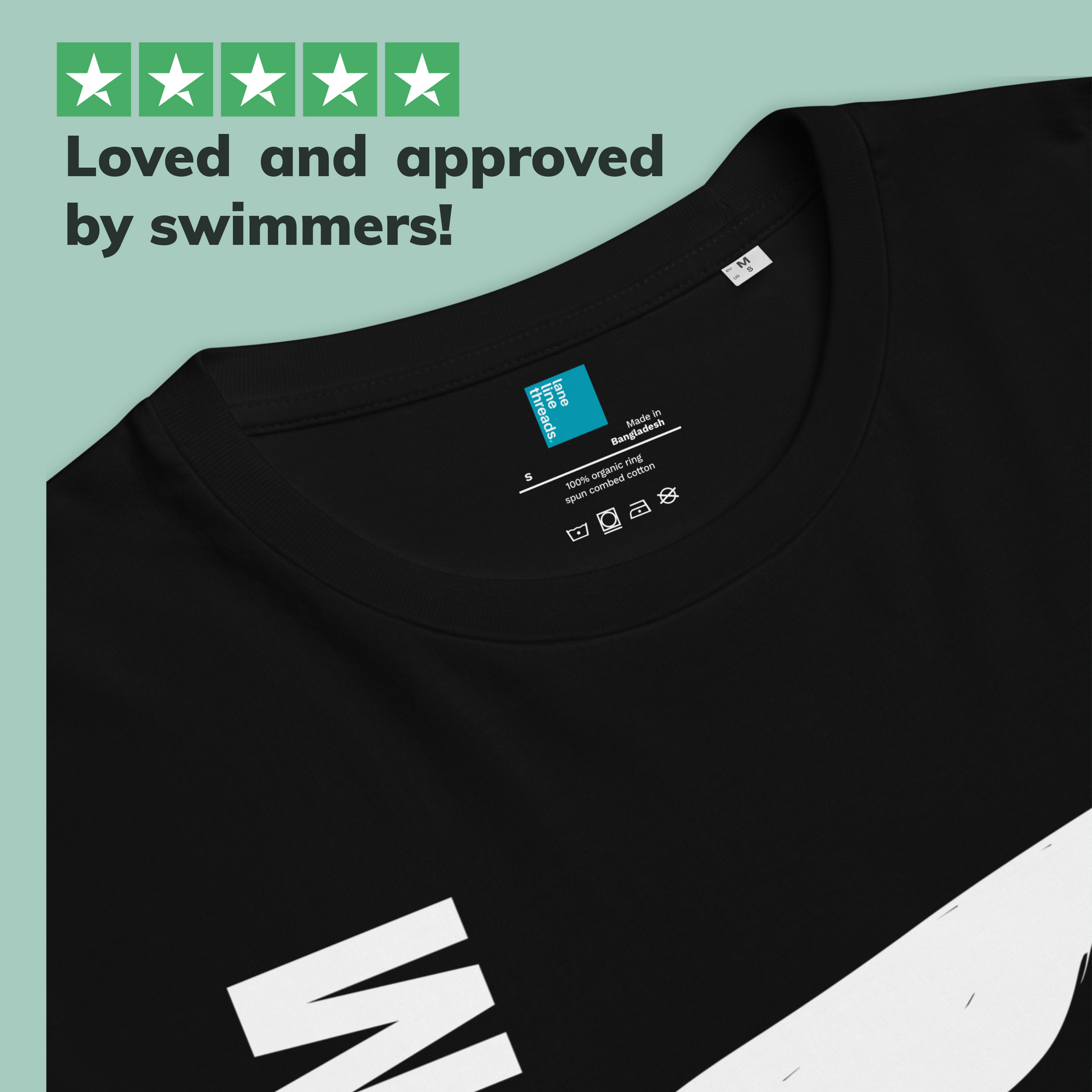Black organic swim mom shirt with a Lane Line Threads brand label and text 'Loved and approved by swimmers!' on a light green background