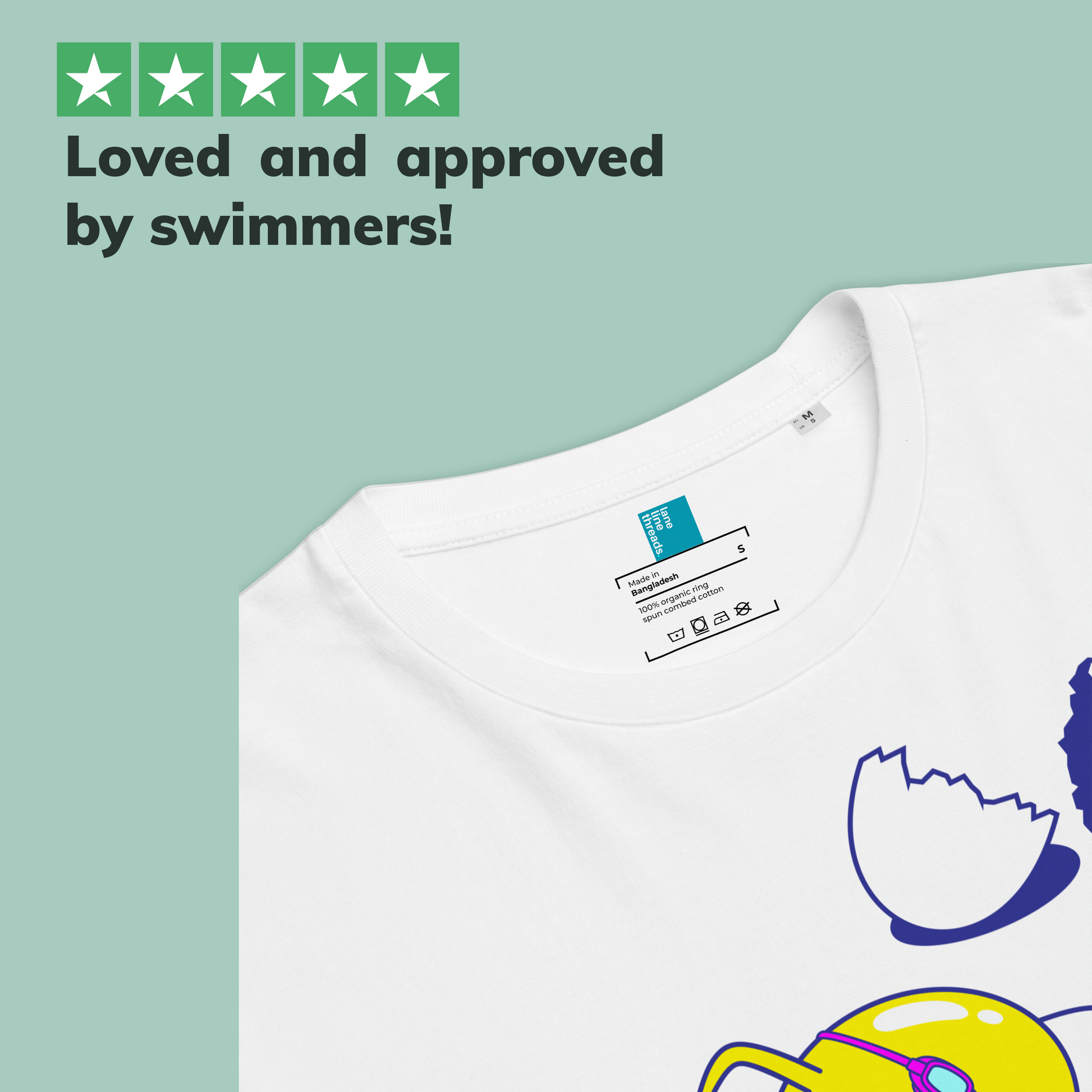 White organic swim shirt with a colorful design on a light green background, featuring text 'Loved and approved by swimmers!'.
