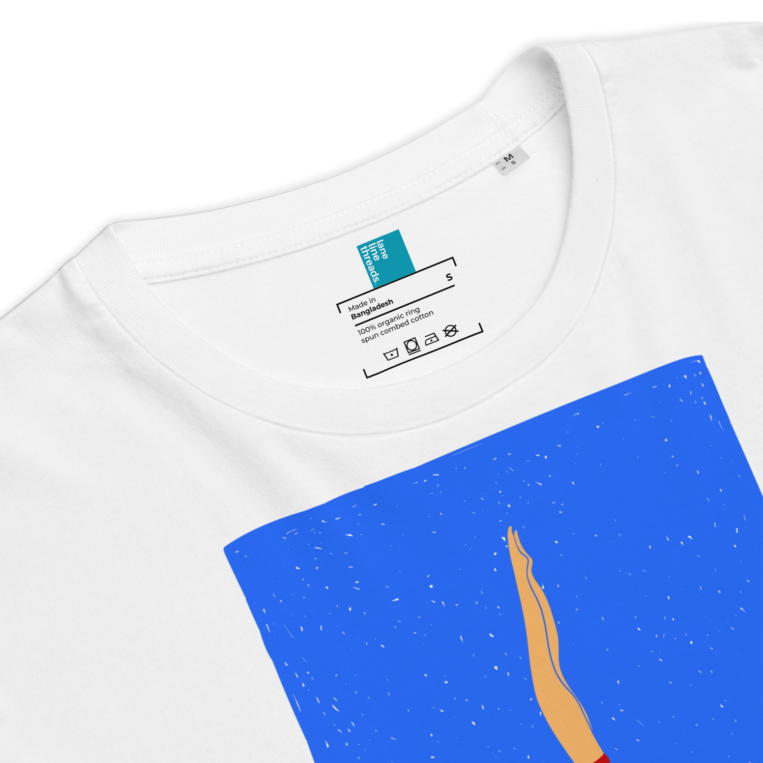 White t-shirt with a blue pocket featuring an abstract design, close-up view.