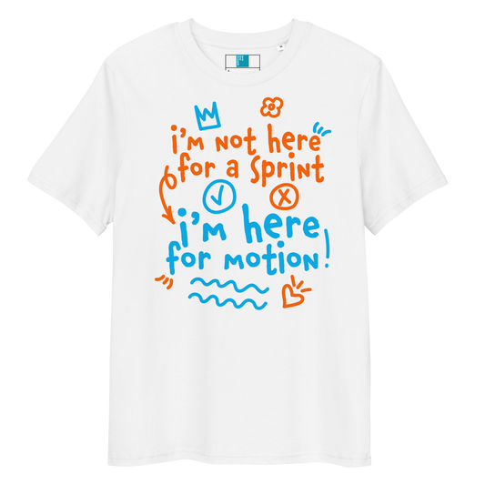 White organic swim shirt with “I’m Not Here for a Sprint, I’m Here for Motion!” text in orange and blue — sustainable tee for USMS swimmers with chlorine-tired skin.