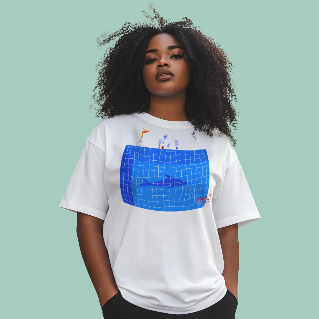 Person wearing a white organic swim shirt with a blue graphic design on a light green background