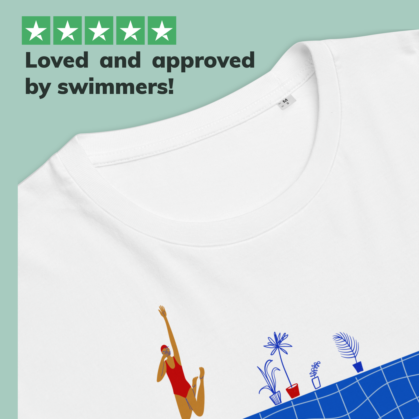 White organic swim shirt with swimmer graphic and pool design, text 'Loved and approved by swimmers!' on a green background.