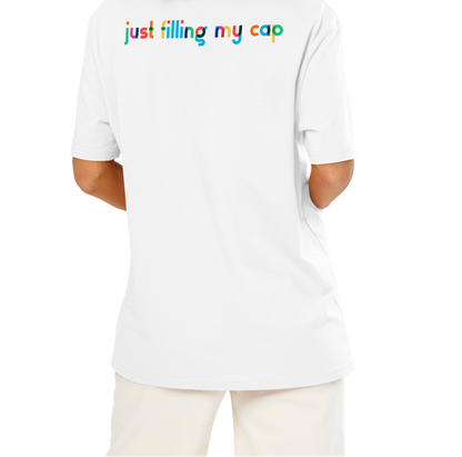 Person wearing a white post swim organic cotton t-shirt with colorful swim-themed text on the back against a white background