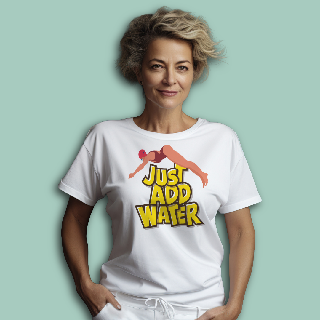 Person wearing a white post swim organic cotton shirt with a graphic design and text "just add water" on a light green background
