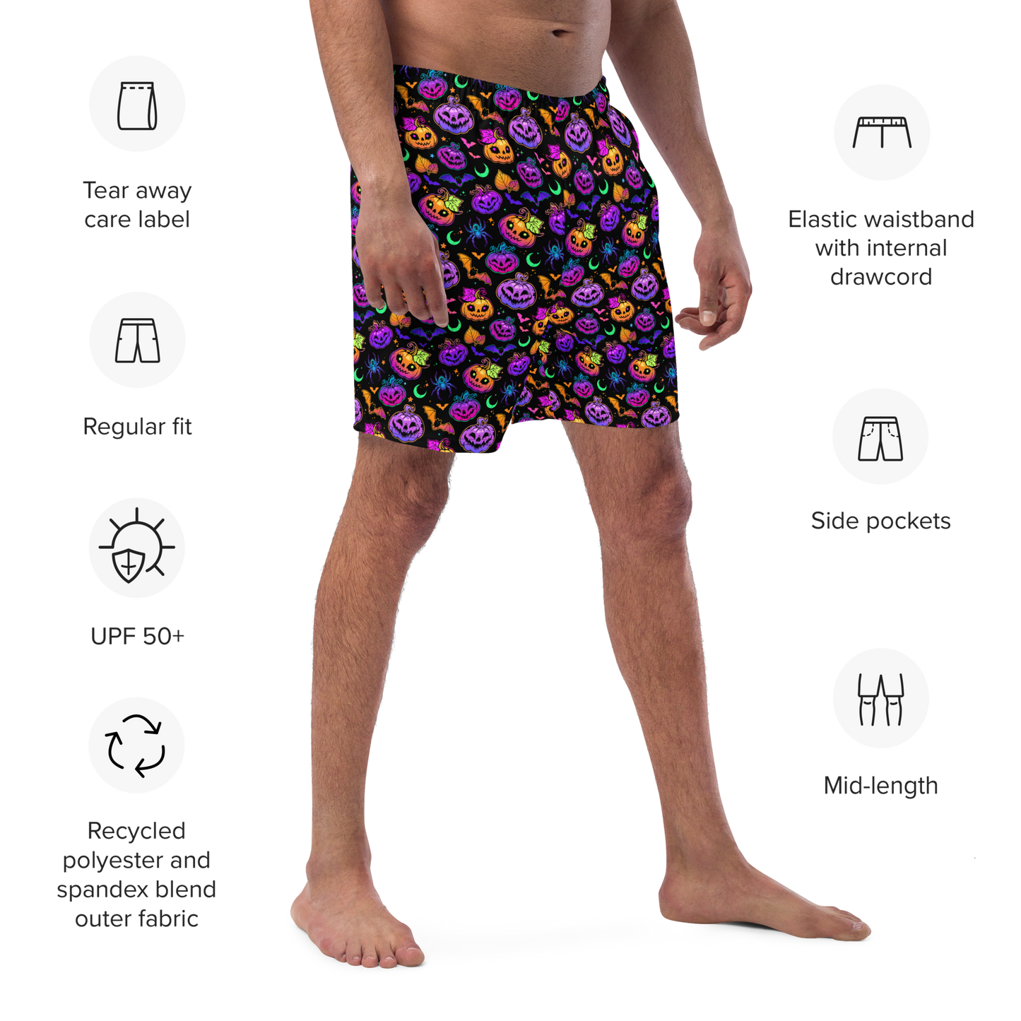 Person wearing colorful Halloween-themed organic swim trunks with product features listed on a white background.