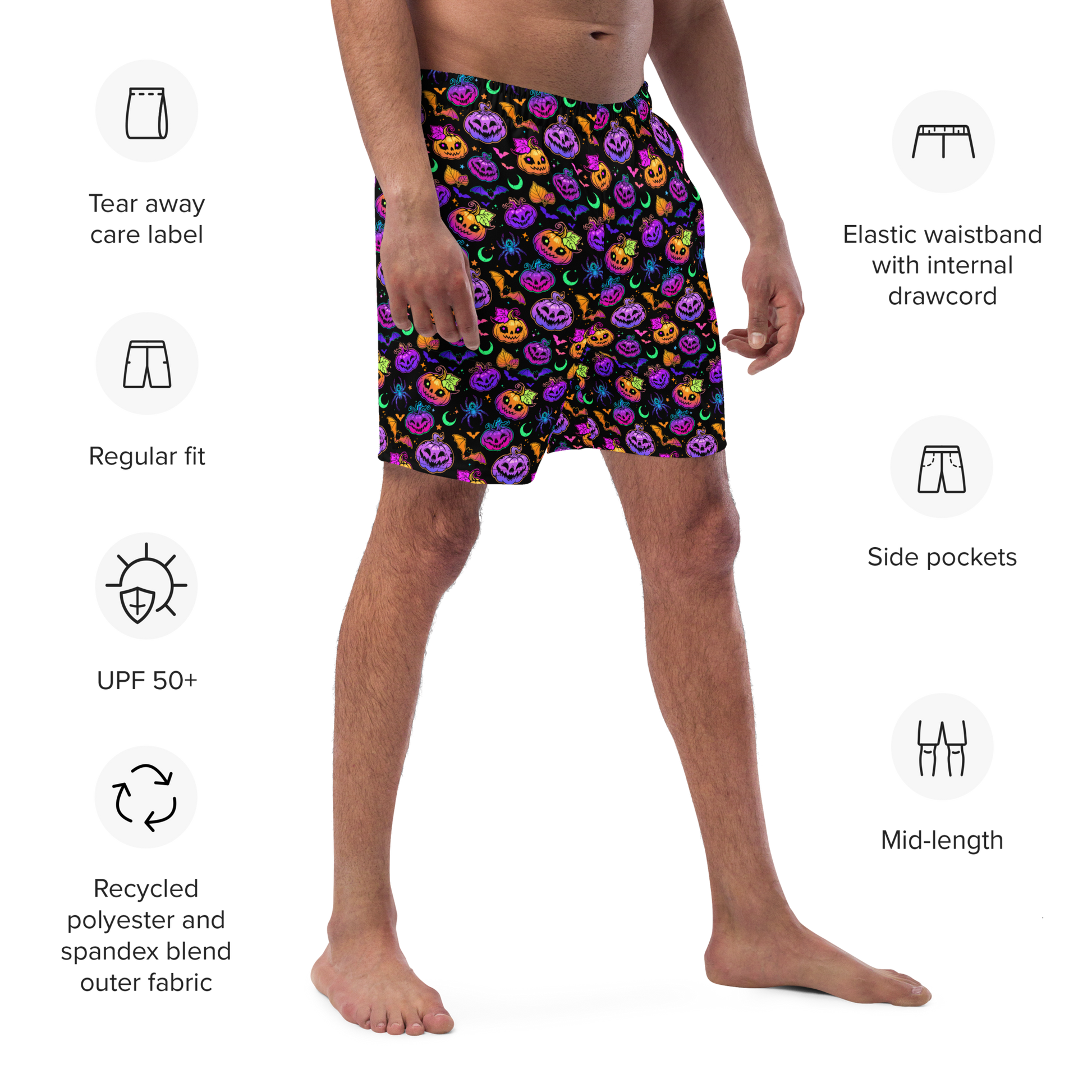 Person wearing colorful Halloween-themed organic swim trunks with product features listed on a white background.