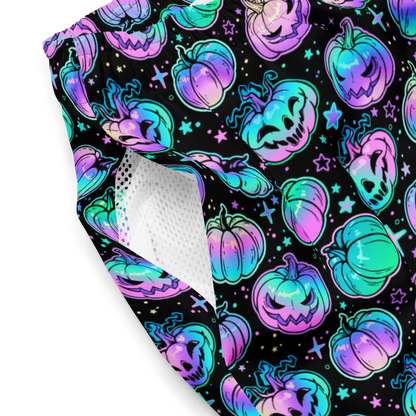 Halloween-themed organic swim trunks with colorful pumpkins inner pockets close-up