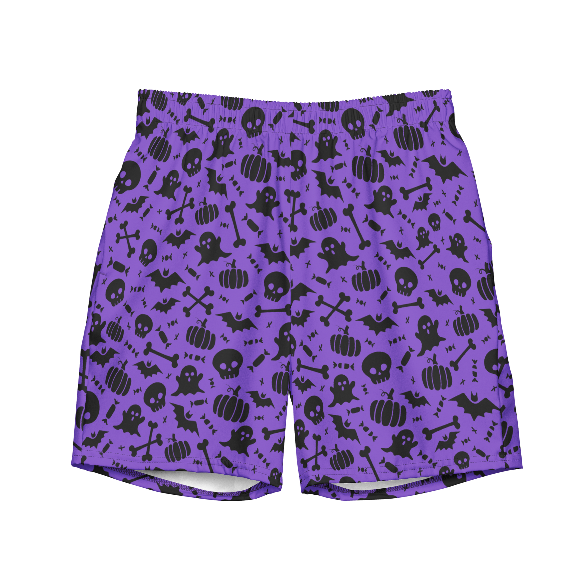 A pair of purple organic swim trunks with a repeating pattern of black Halloween-themed graphics including ghosts, pumpkins, skulls, bats, and bones. 