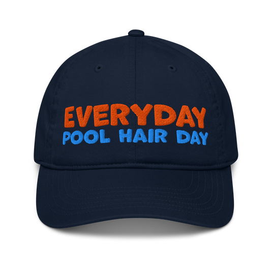Navy organic baseball cap with bold orange and blue embroidery reading "EVERYDAY POOL HAIR DAY." Made from 100% organic cotton, breathable and eco-friendly.