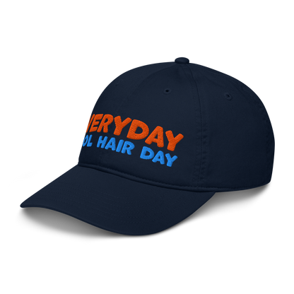 Side view of navy organic baseball cap angled left, highlighting soft, curved brim and minimalist stitching. Made from sustainable, biodegradable cotton.