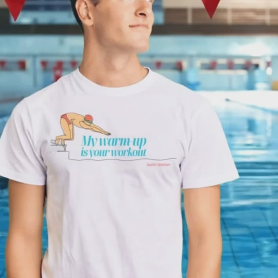 A short video of a young man, wearing swim shirt with slogan "my warm-up is your workout" on it, staying on the pool deck.