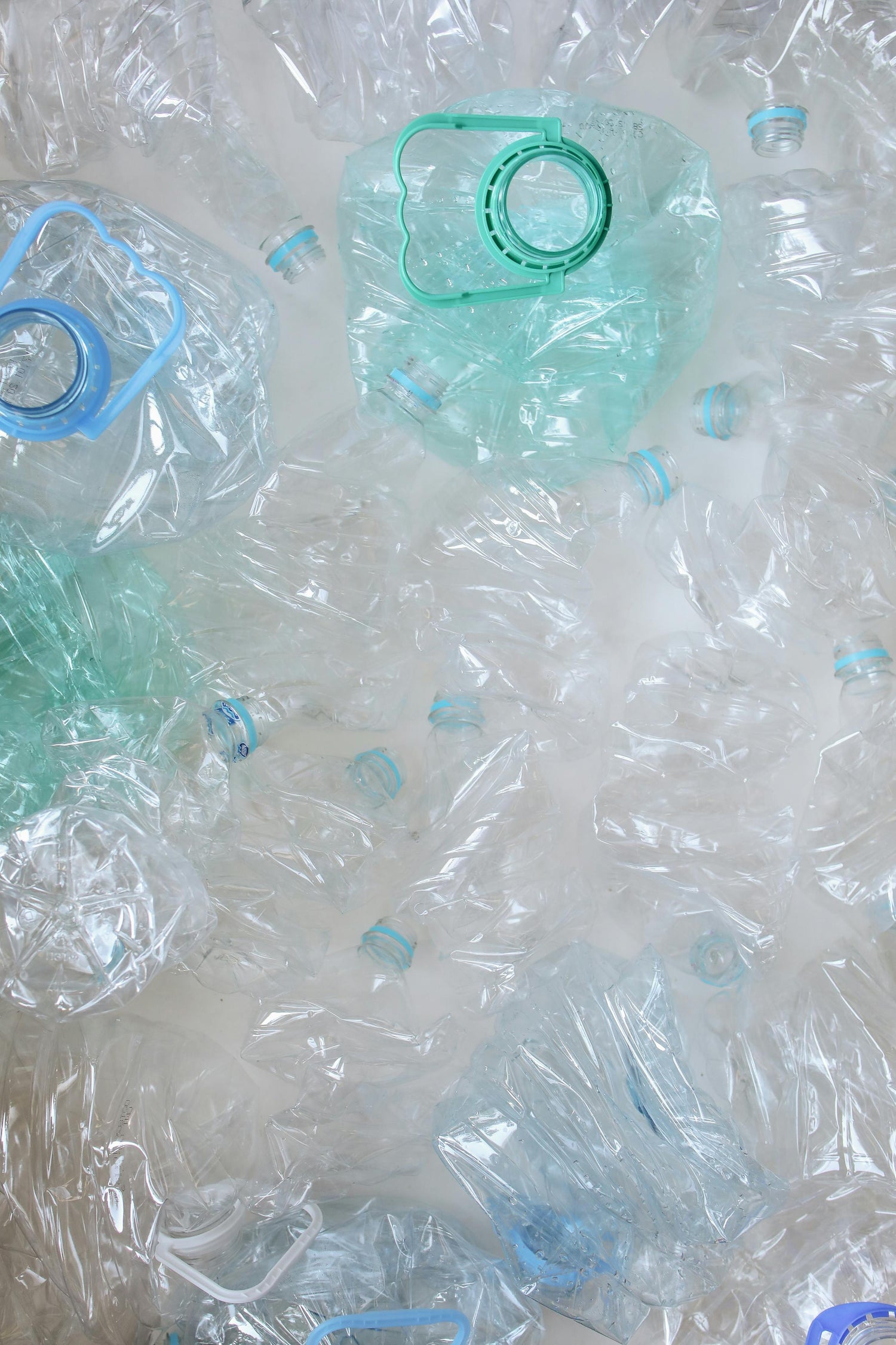 bunch of plastic bottles are ready for recycling