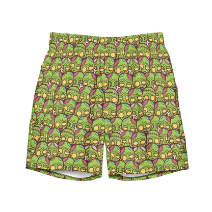 Halloween recycled swim trunks with cartoon zombie face pattern in green and purple. Eco-friendly organic swim trunks made from 100% recycled polyester.