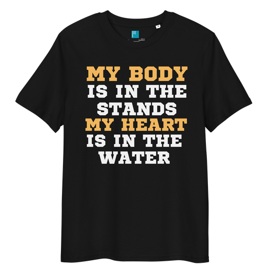 Black organic cotton swim mom t-shirt with bold text: “My Body Is in the Stands, My Heart Is in the Water,” displayed on transparent background