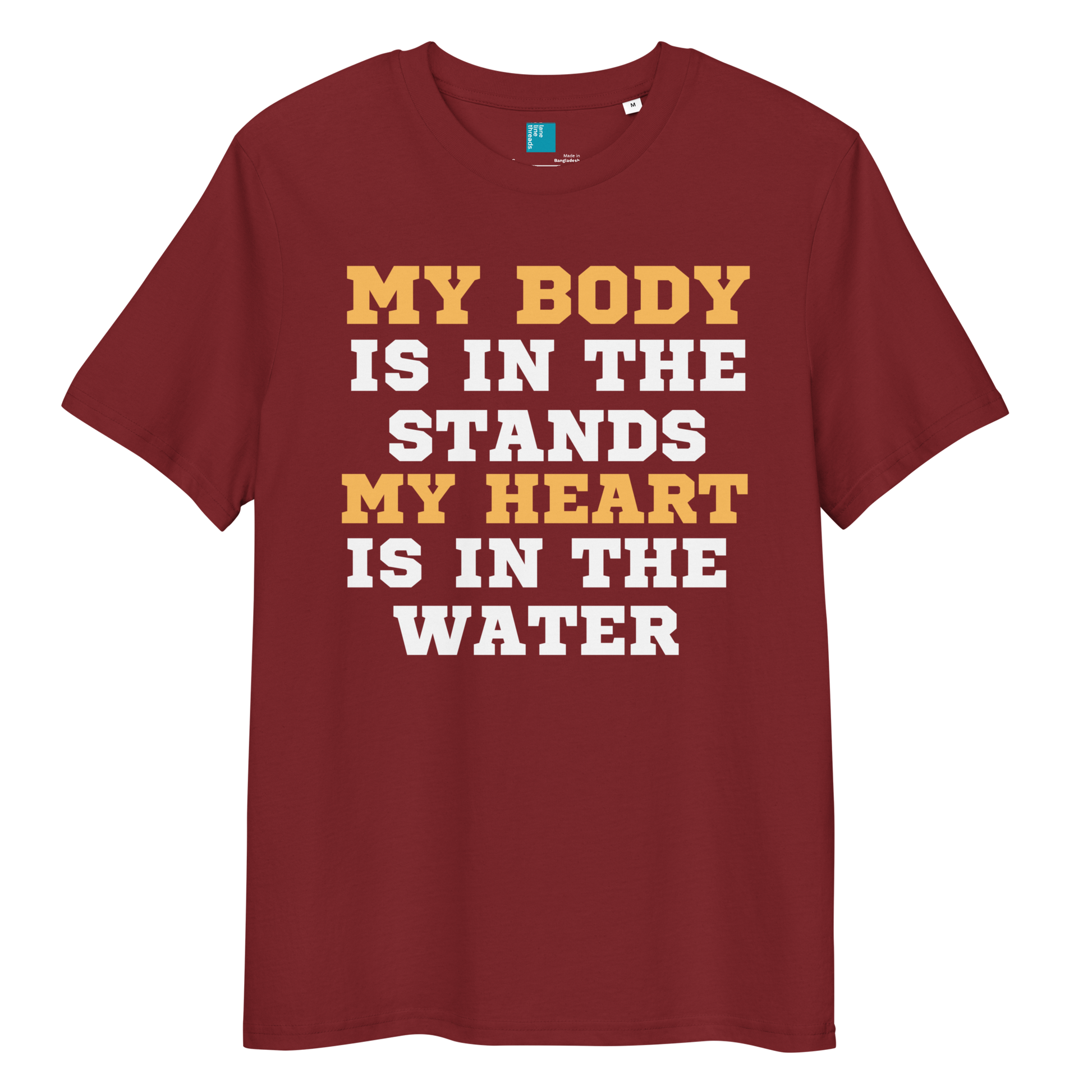 burgundy organic cotton swim mom t-shirt with bold text: “My Body Is in the Stands, My Heart Is in the Water,” displayed on transparent background