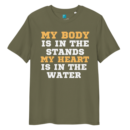 Khaki organic cotton swim mom t-shirt with bold text: “My Body Is in the Stands, My Heart Is in the Water,” displayed on transparent background
