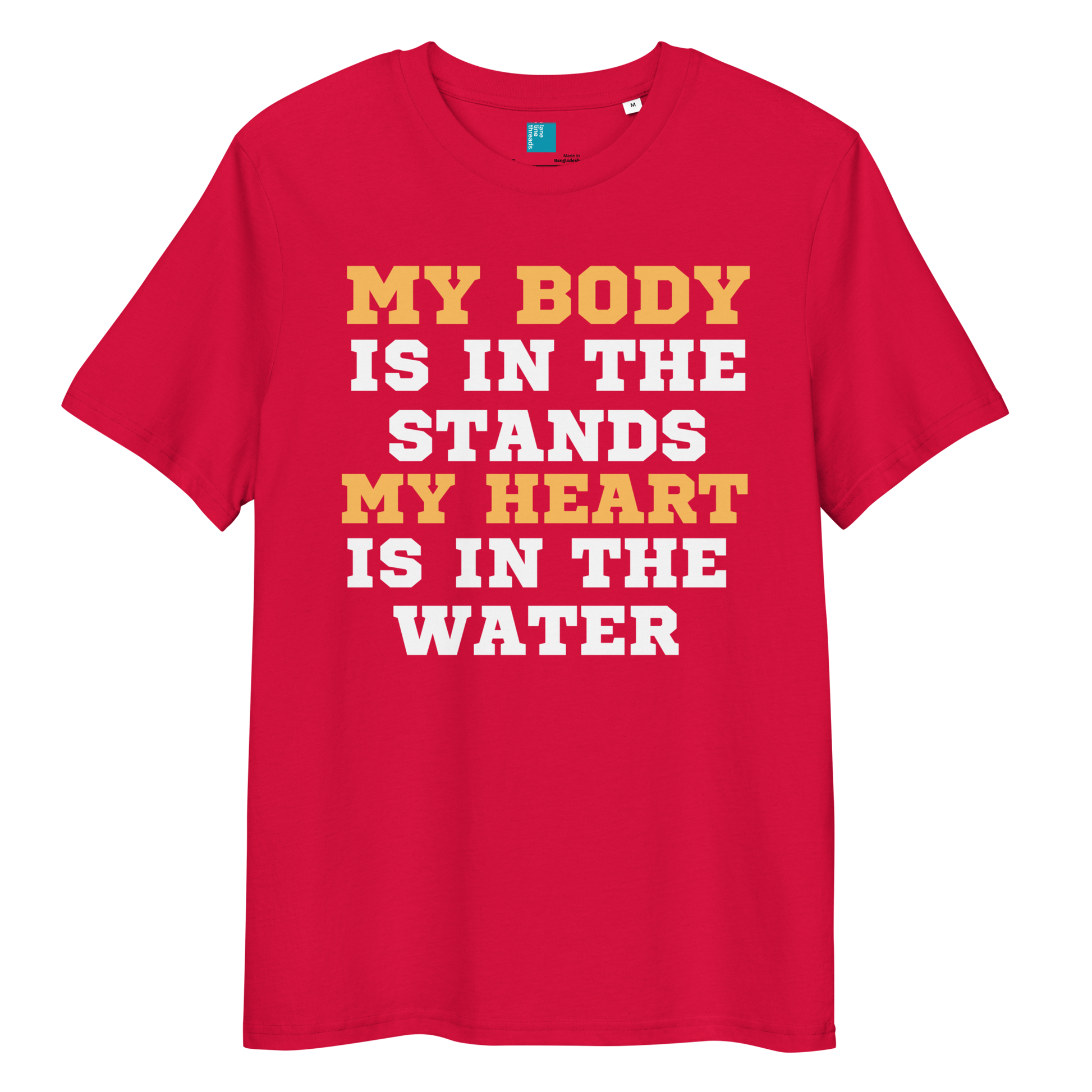 Red organic cotton swim mom t-shirt with bold text: “My Body Is in the Stands, My Heart Is in the Water,” displayed on transparent background