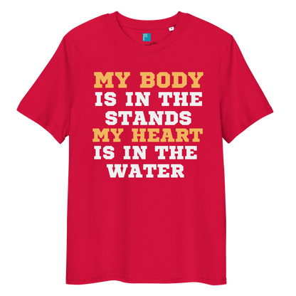 Red organic cotton swim mom t-shirt with bold text: “My Body Is in the Stands, My Heart Is in the Water,” displayed on transparent background