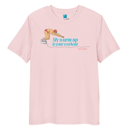 Organic funny swim shirt in pink with text 'My Warm-Up Is Your Workout' and swimmer graphic.