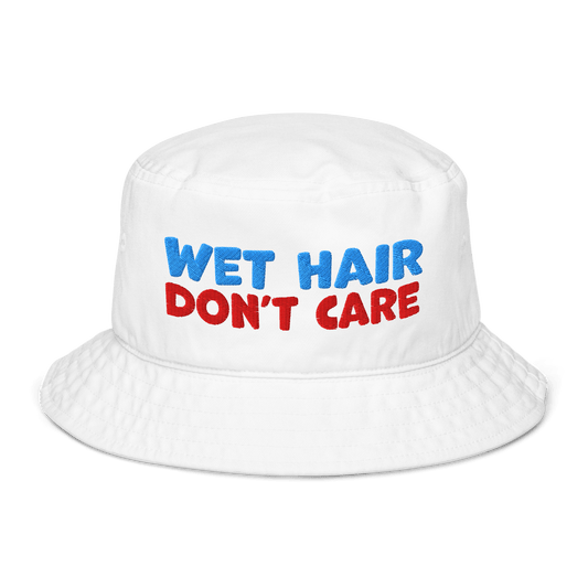 White organic cotton bucket hat with "WET HAIR" in blue and "DON'T CARE" in red embroidered text